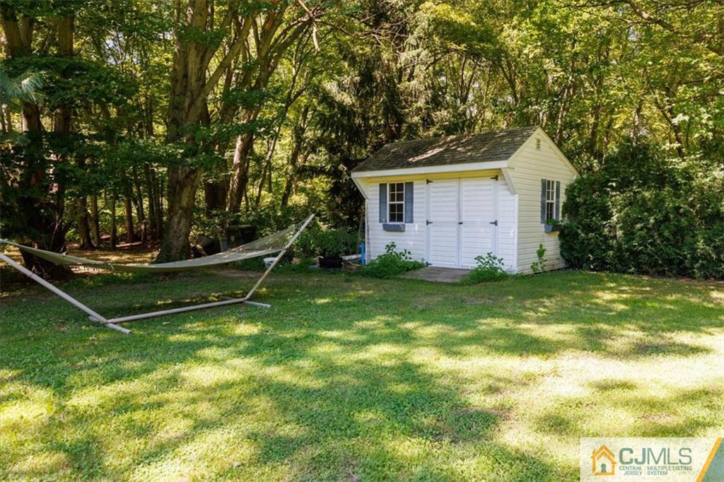 81 Spring Hill Road Old Bridge, NJ 07747 - Photo 8 of 40 a view of a house with backyard