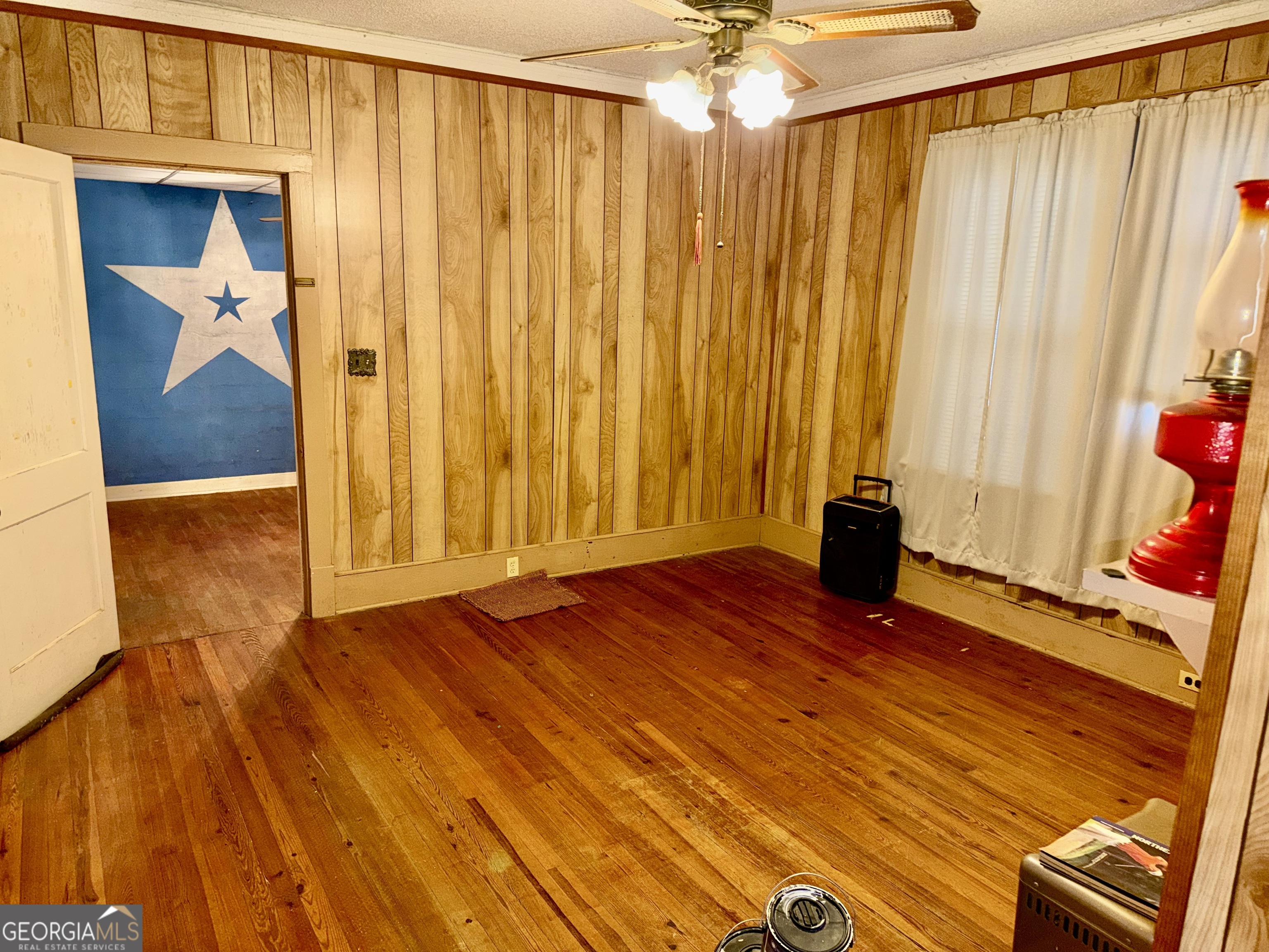 349 Cook Street Elberton, GA 30635 - Photo 12 of 22 a view of a room with wooden floor and a window