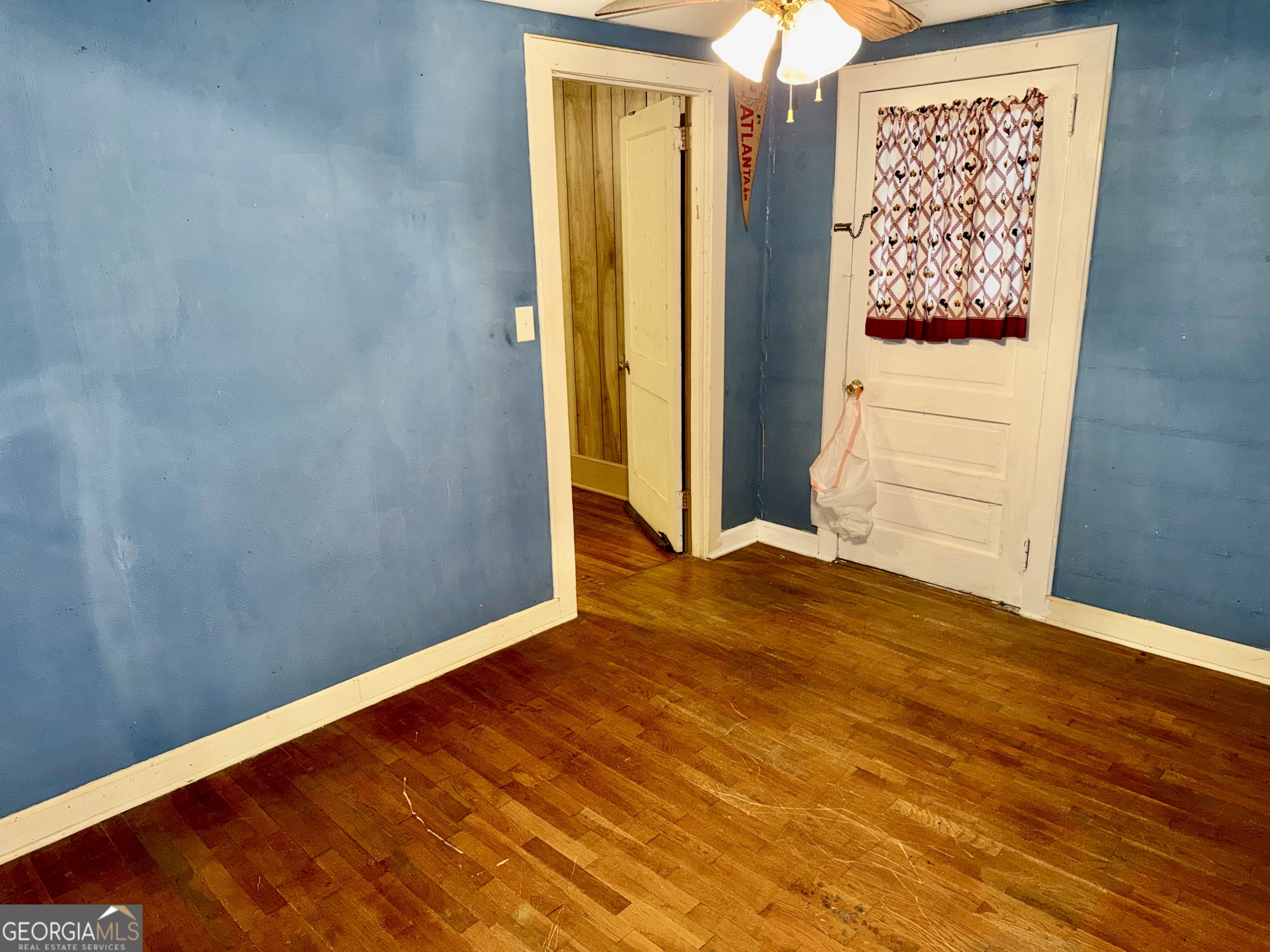 349 Cook Street Elberton, GA 30635 - Photo 15 of 22 a view of room with window and wooden floor