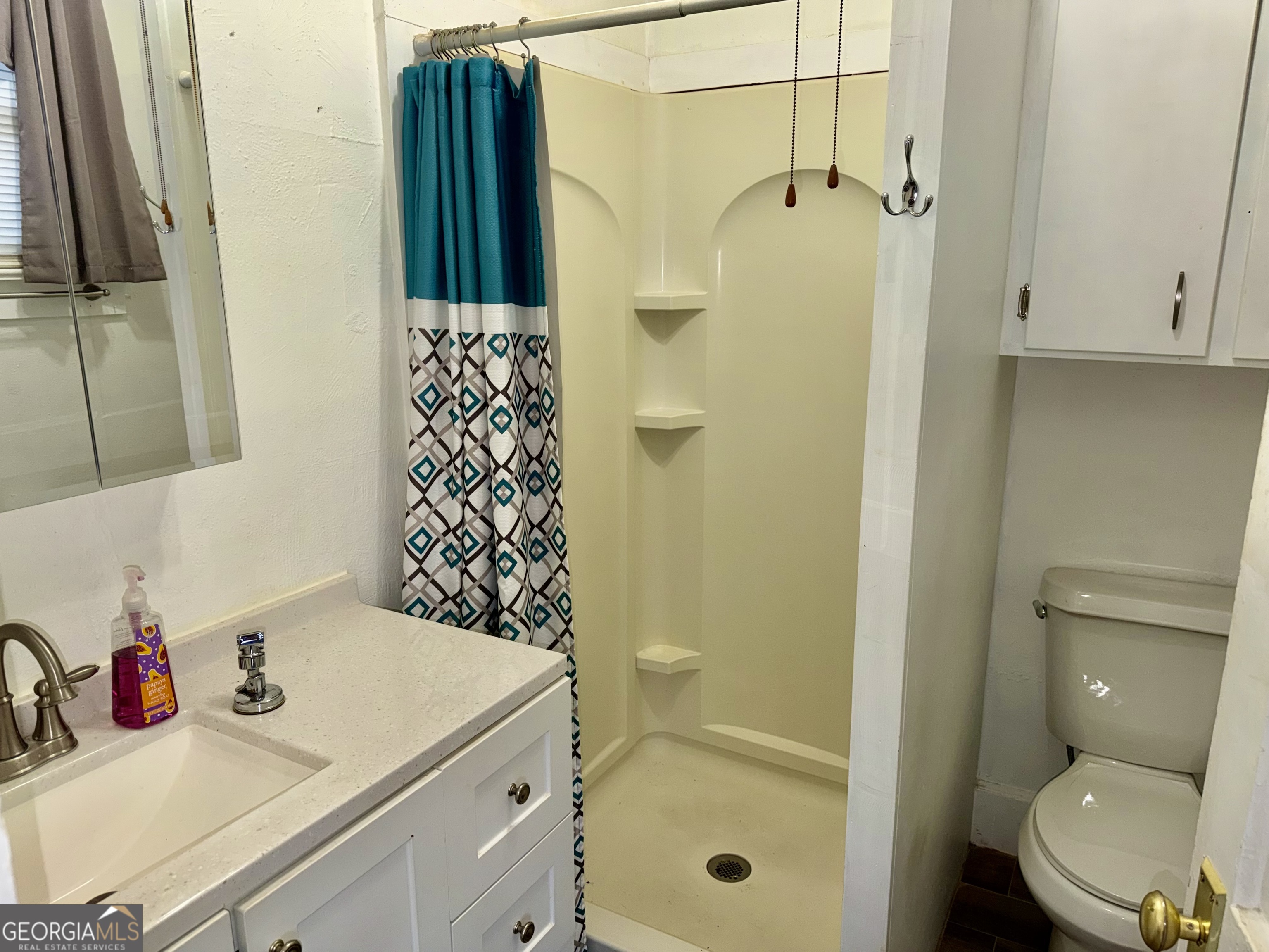 349 Cook Street Elberton, GA 30635 - Photo 21 of 22 a bathroom with a sink toilet and shower
