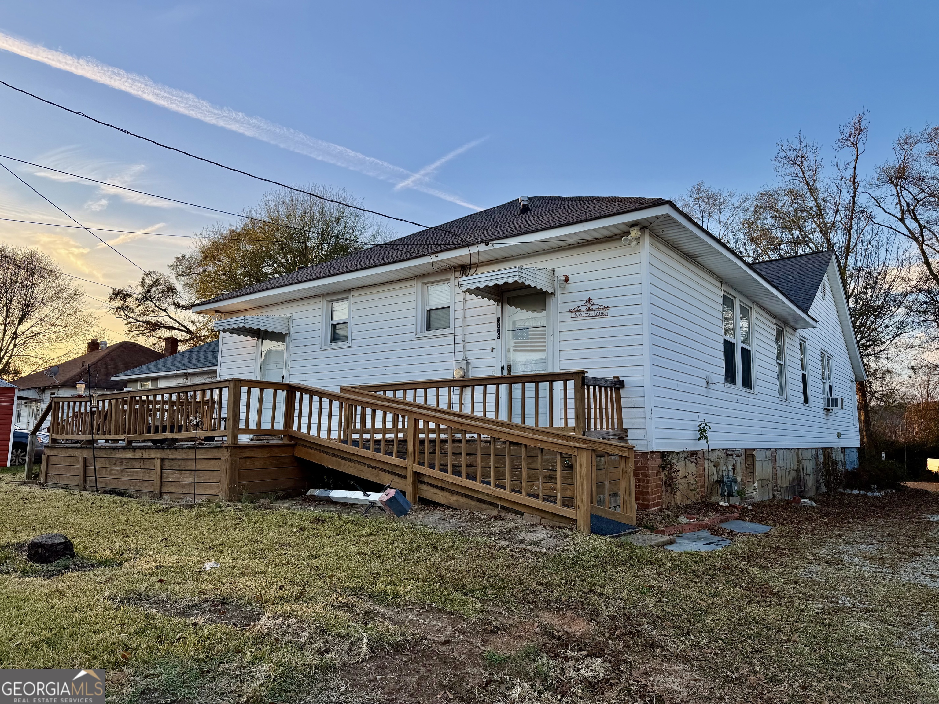 349 Cook Street Elberton, GA 30635 - Photo 5 of 22 a view of a house with a yard and deck