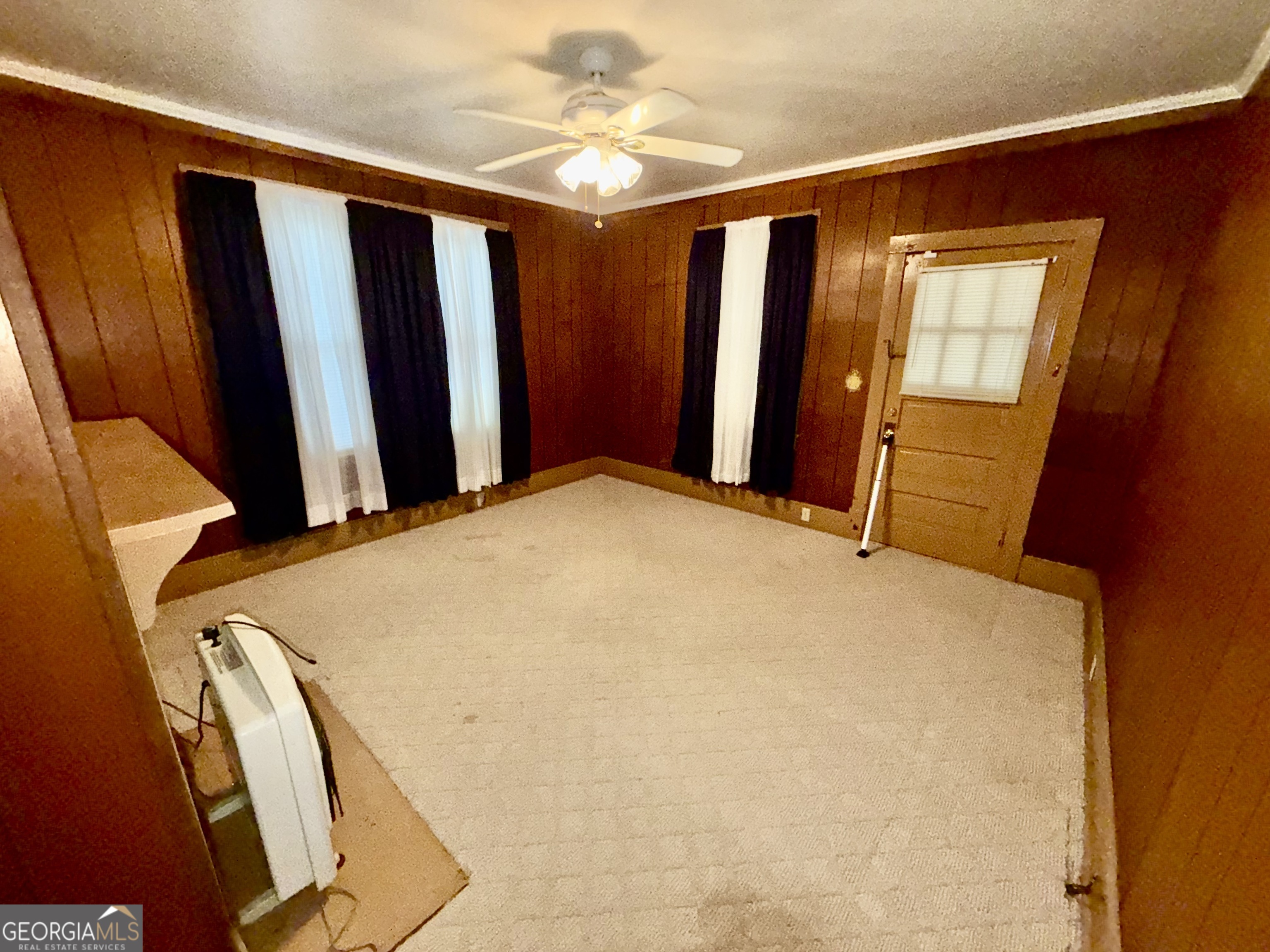 349 Cook Street Elberton, GA 30635 - Photo 7 of 22 a bed room with a bed and a mirror