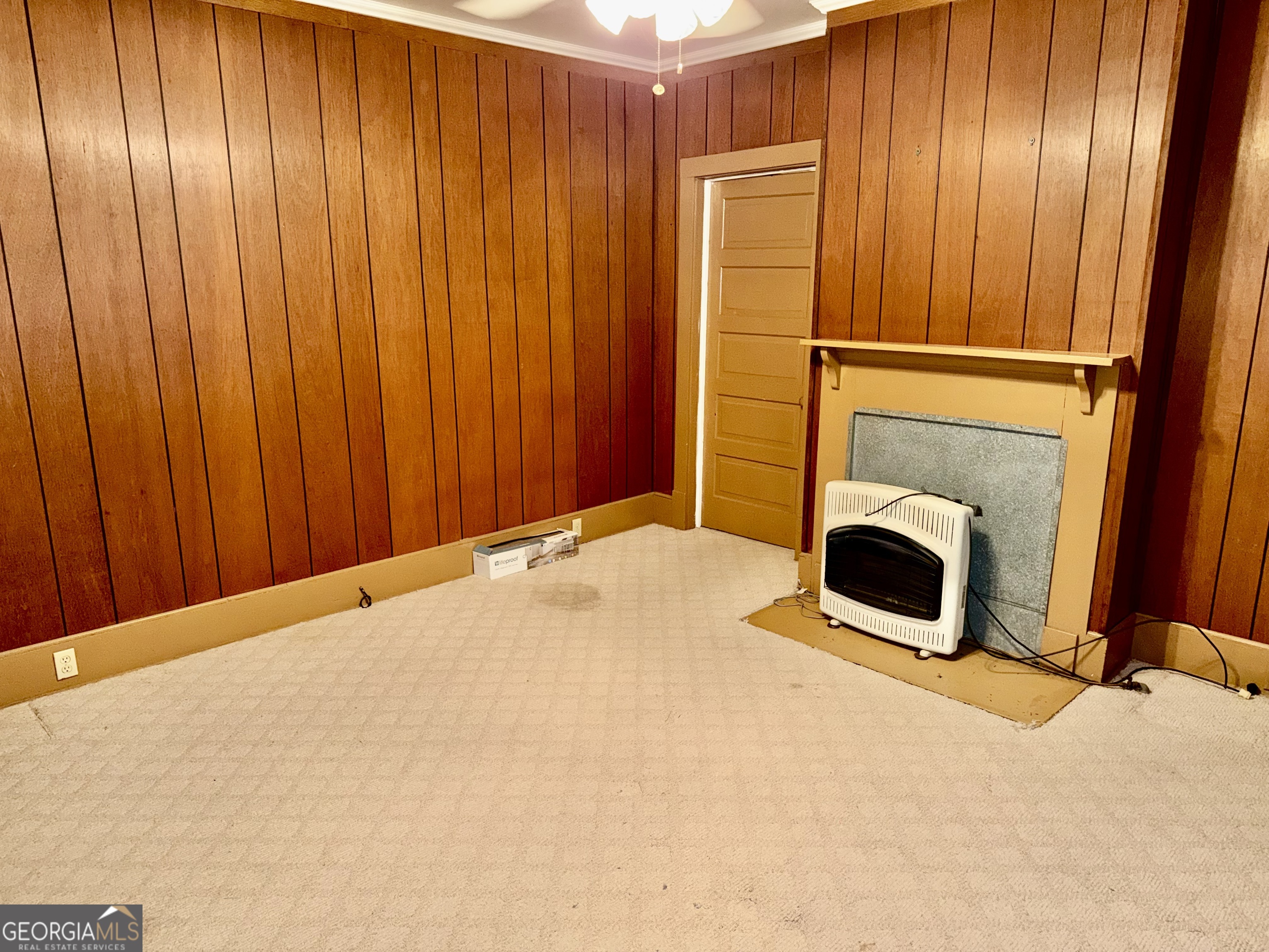349 Cook Street Elberton, GA 30635 - Photo 8 of 22 a view of an empty room with a fireplace