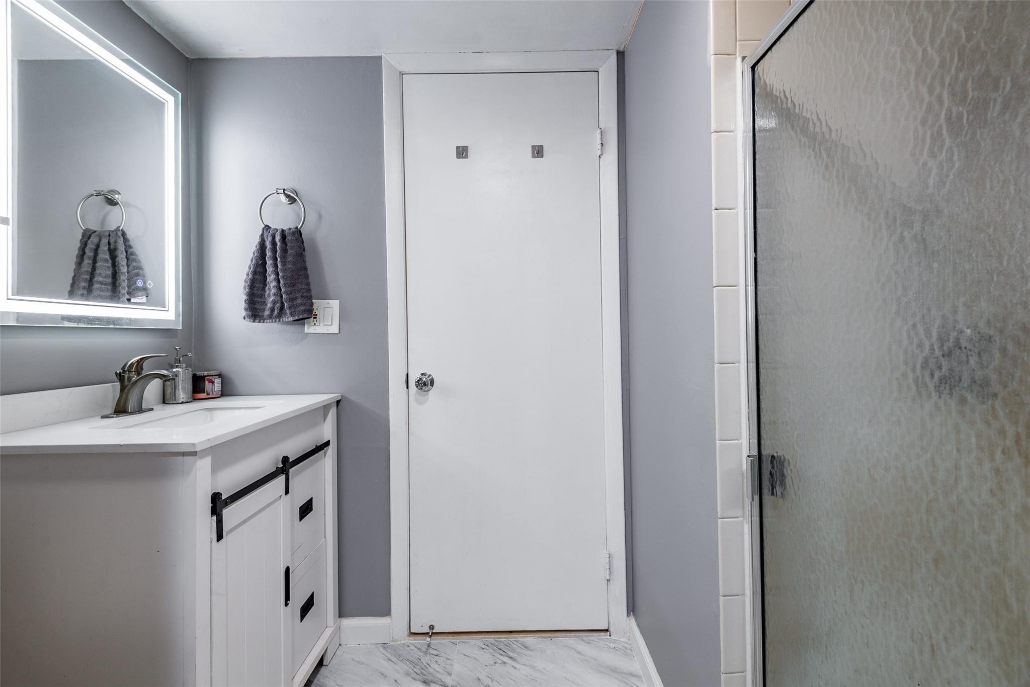 22208 Boca Rancho Drive, Unit D Boca Raton, FL 33428 - Photo 13 of 34 a bathroom with a sink and a mirror
