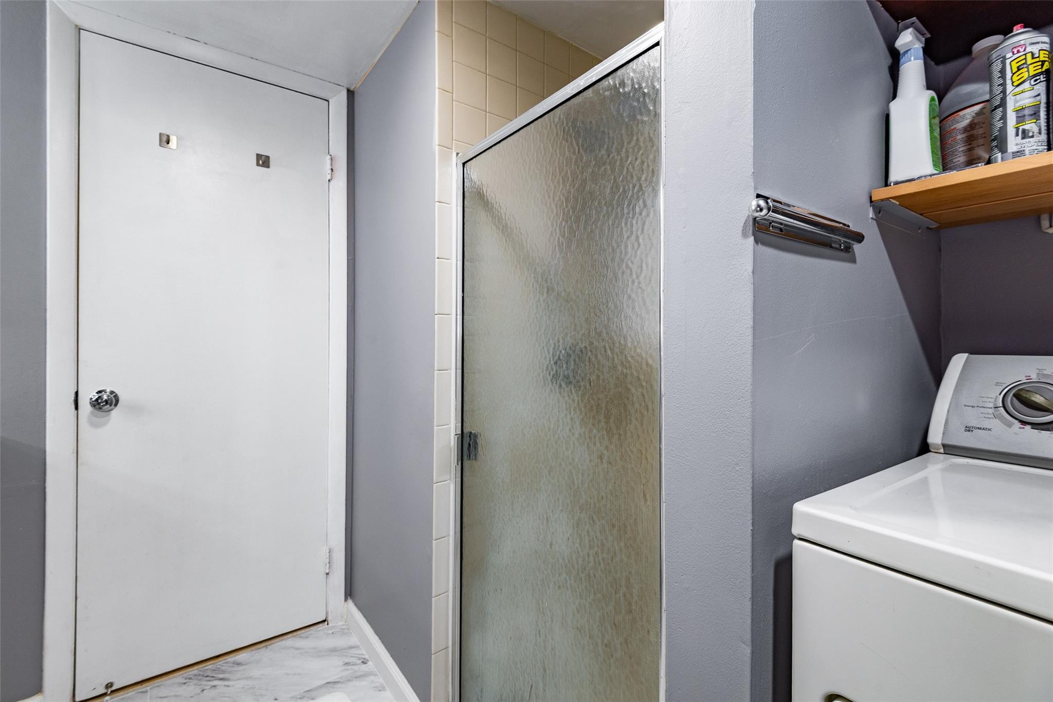 22208 Boca Rancho Drive, Unit D Boca Raton, FL 33428 - Photo 14 of 34 a bathroom with a toilet and a shower