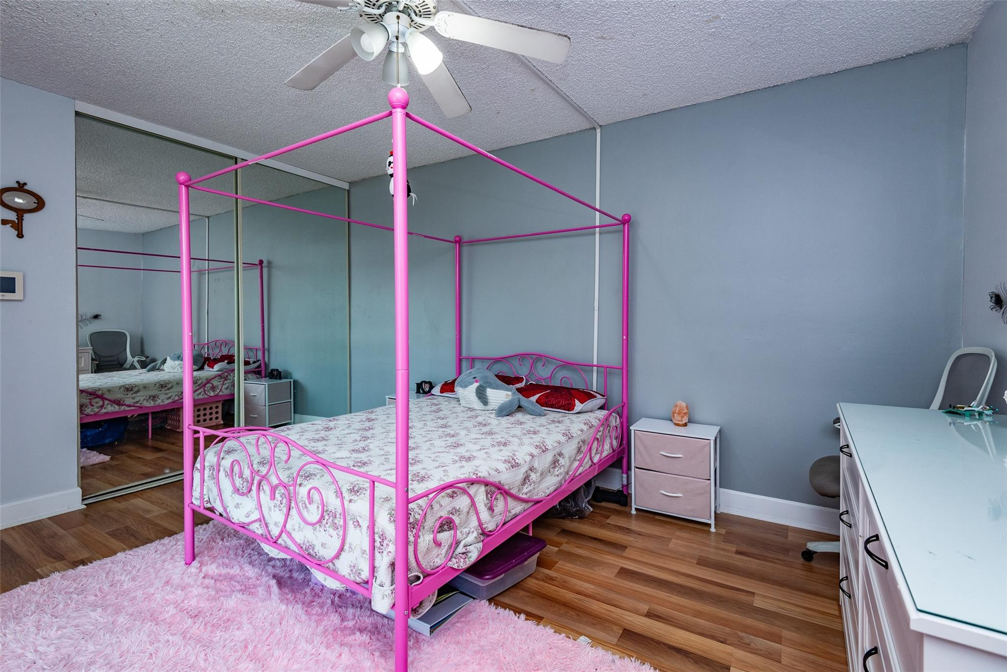 22208 Boca Rancho Drive, Unit D Boca Raton, FL 33428 - Photo 21 of 34 a bedroom with a bed and a chandelier