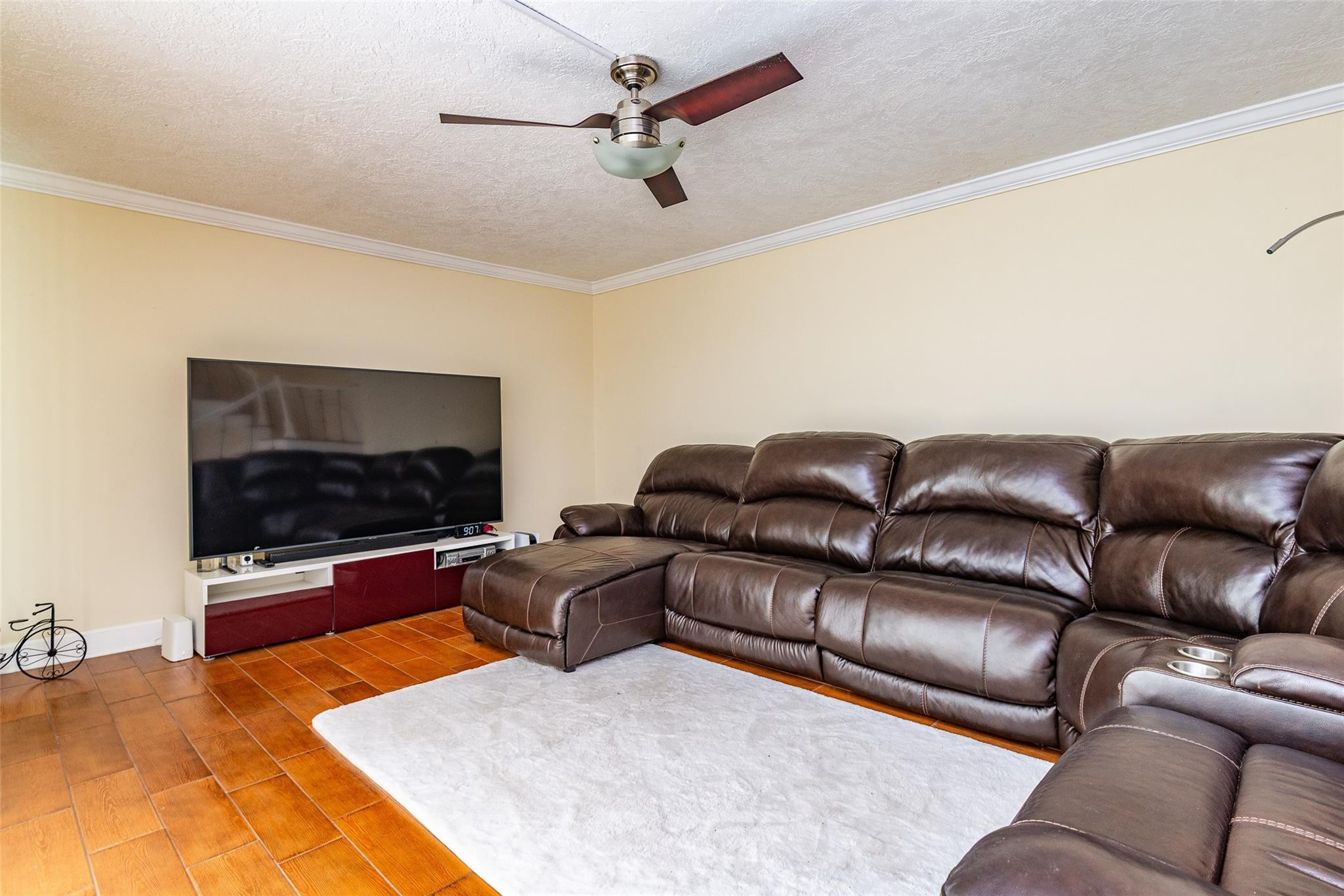 22208 Boca Rancho Drive, Unit D Boca Raton, FL 33428 - Photo 3 of 34 a living room with furniture and a flat screen tv