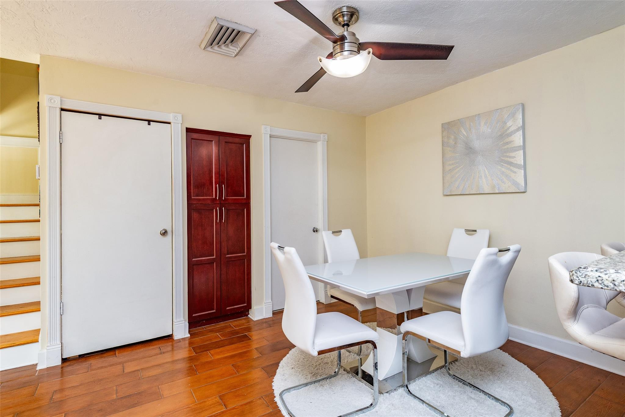 22208 Boca Rancho Drive, Unit D Boca Raton, FL 33428 - Photo 7 of 34 a view of a room with furniture and wooden floor