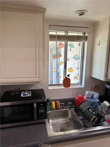 a bedroom with a bed and flat screen tv