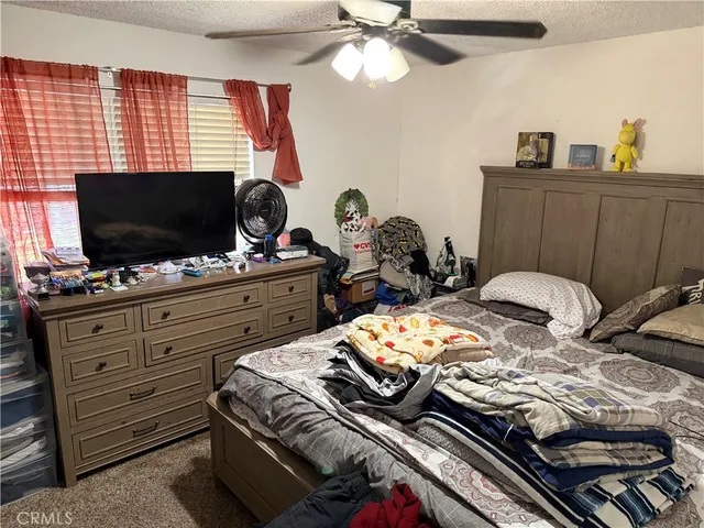 a view of a hallway with wooden floor and stairs