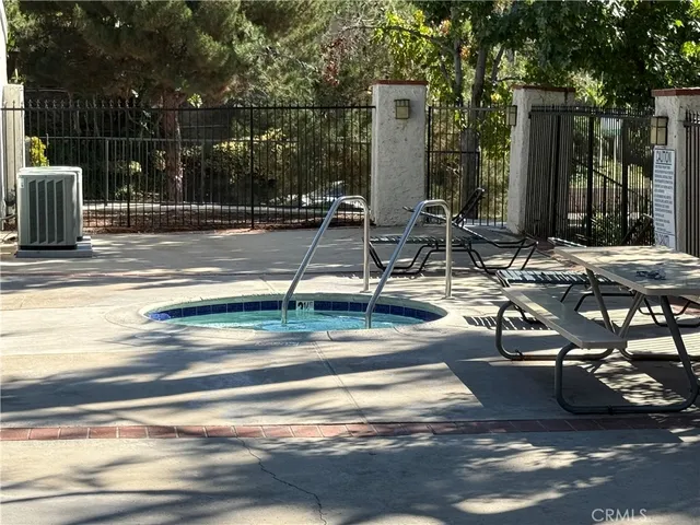 a view of a patio with a table and chairs
