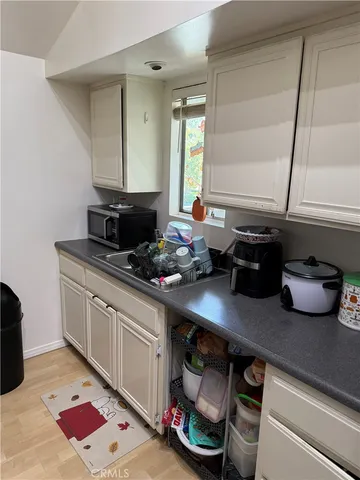 a store room with lots of furniture and clutter