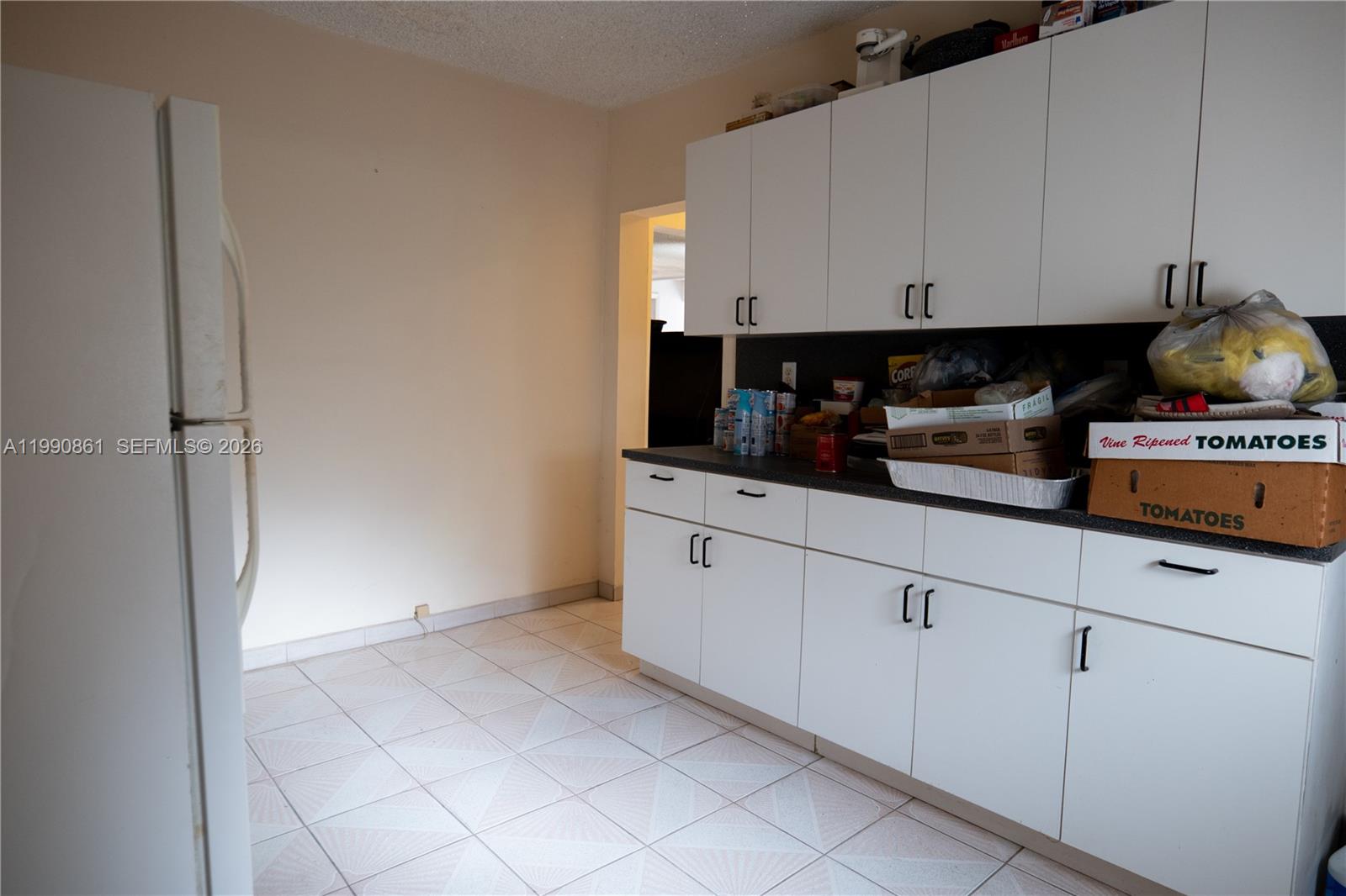 2323 Southwest 17th Terrace Miami, FL 33145 - Photo 11 of 24 a kitchen with cabinets and appliances