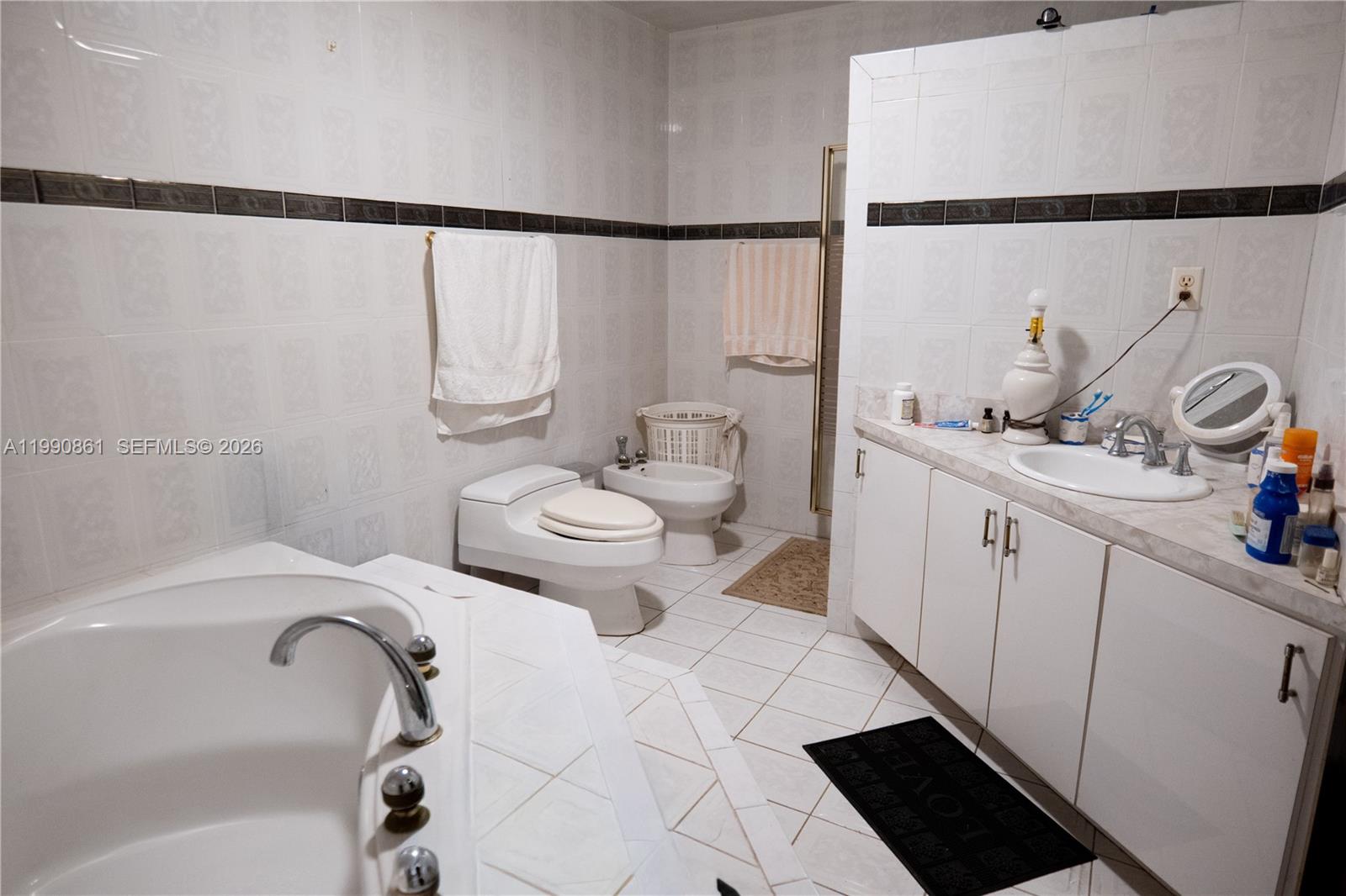 2323 Southwest 17th Terrace Miami, FL 33145 - Photo 14 of 24 a bathroom with a sink toilet and shower
