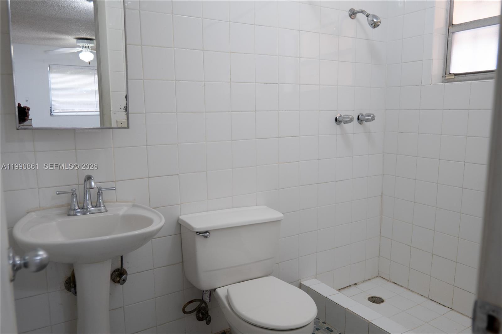 2323 Southwest 17th Terrace Miami, FL 33145 - Photo 16 of 24 a bathroom with a sink toilet and shower