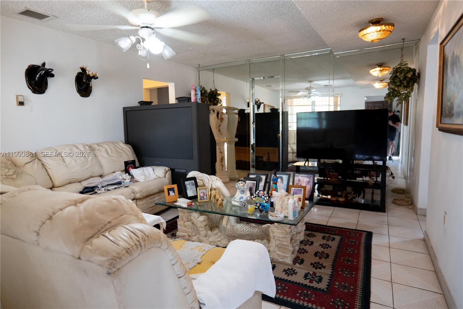 2323 Southwest 17th Terrace Miami, FL 33145 - Photo 18 of 24 a living room with furniture and a flat screen tv