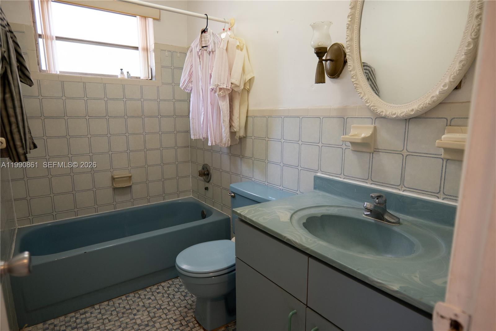 2323 Southwest 17th Terrace Miami, FL 33145 - Photo 20 of 24 a bathroom with a sink a toilet and bathtub