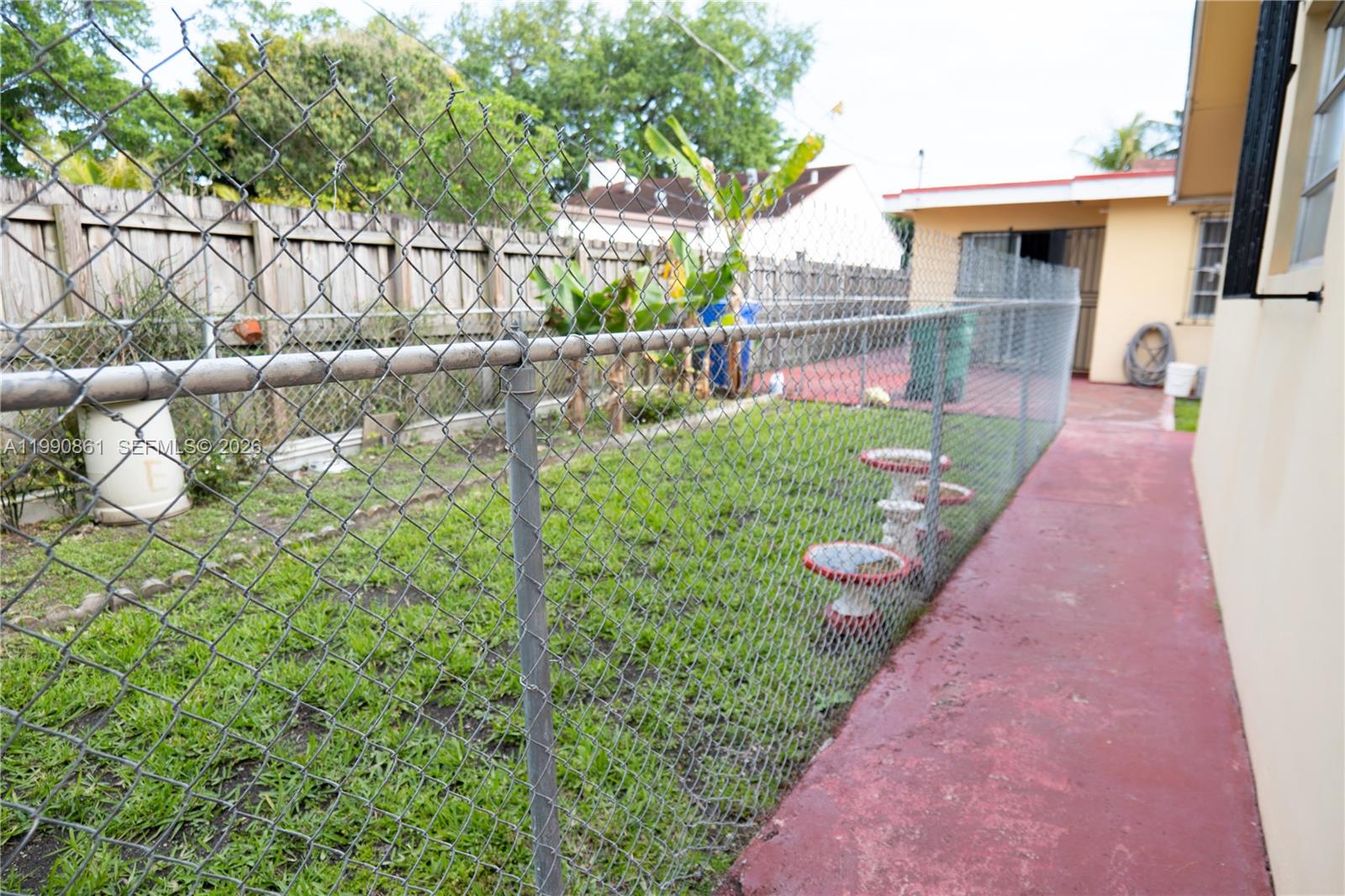 2323 Southwest 17th Terrace Miami, FL 33145 - Photo 22 of 24 a view of a house with a backyard and a garden