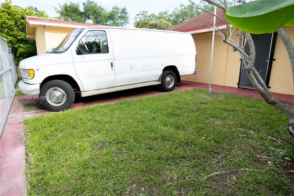a view of a backyard with truck parked