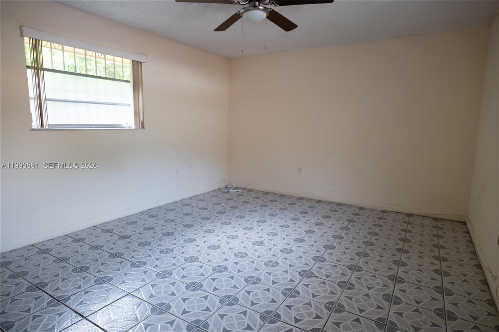 2323 Southwest 17th Terrace Miami, FL 33145 - Photo 5 of 24 an empty room with windows