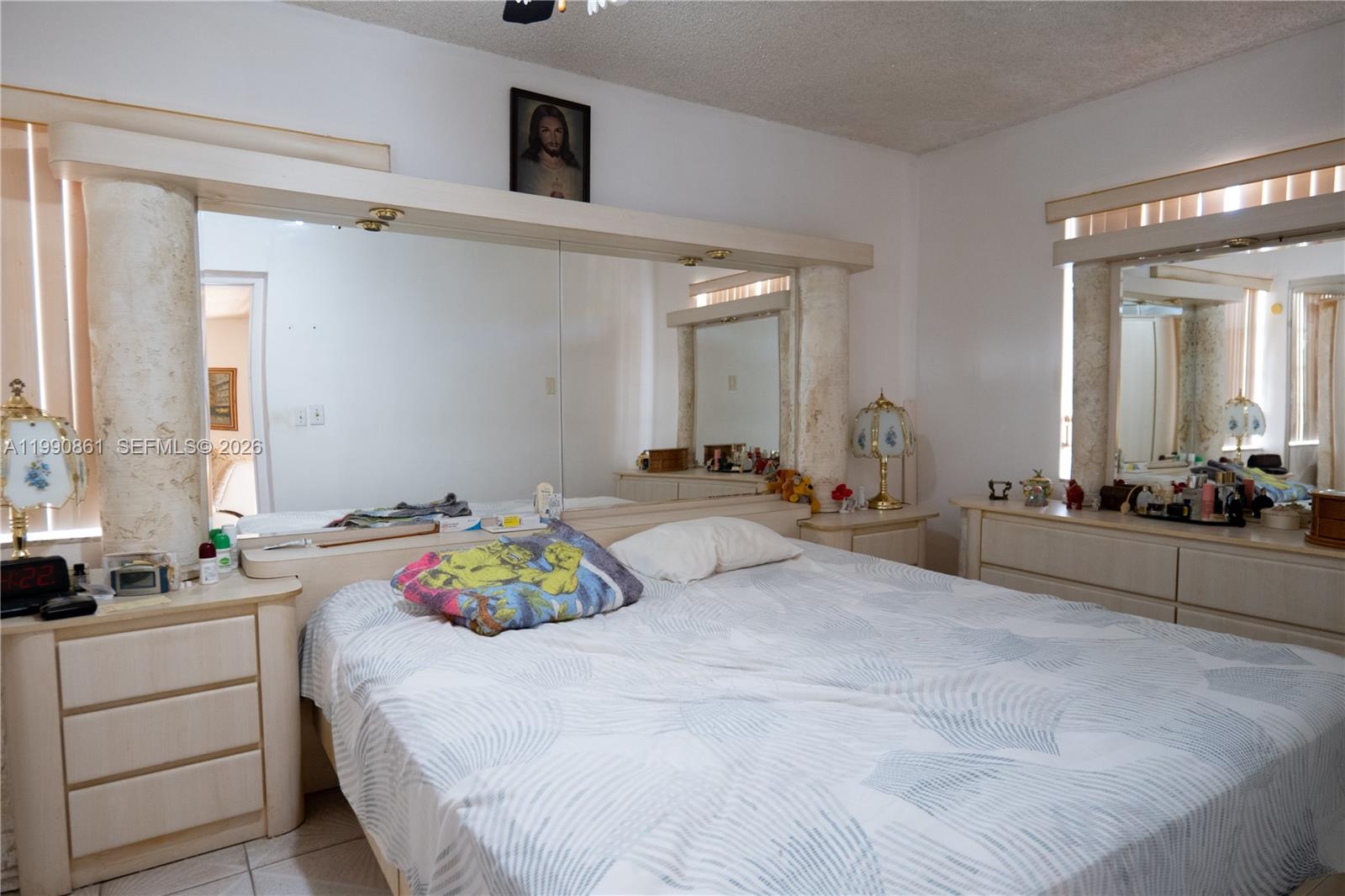 2323 Southwest 17th Terrace Miami, FL 33145 - Photo 7 of 24 a bedroom with a bed and a mirror