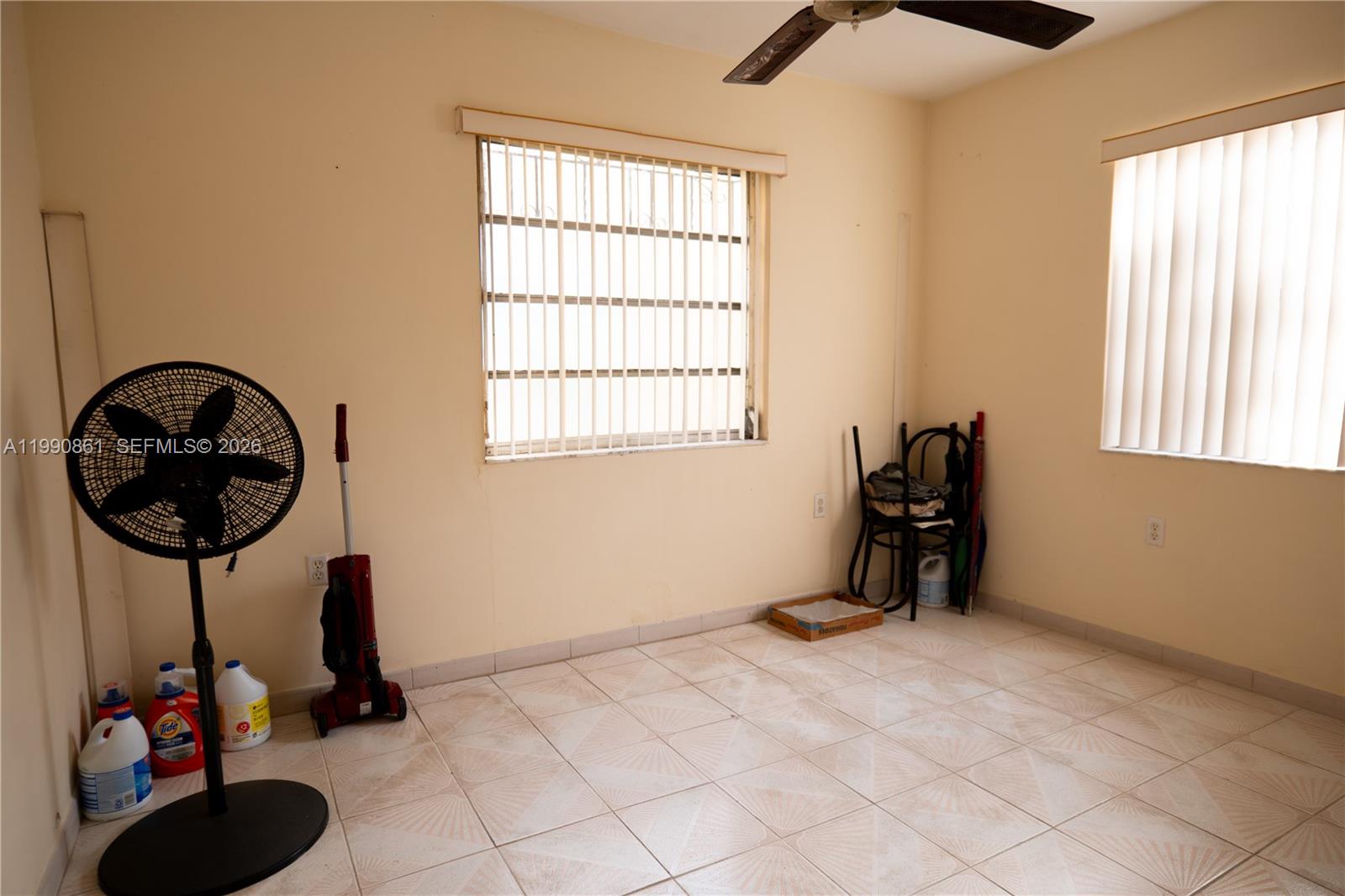 2323 Southwest 17th Terrace Miami, FL 33145 - Photo 9 of 24 a room with gym equipment and a window