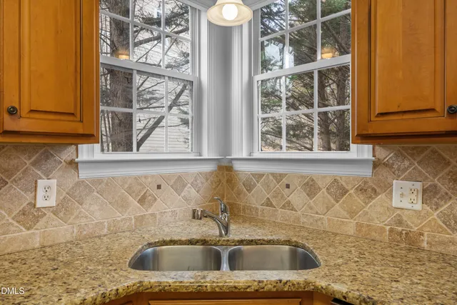 a stove top oven sitting inside of a kitchen