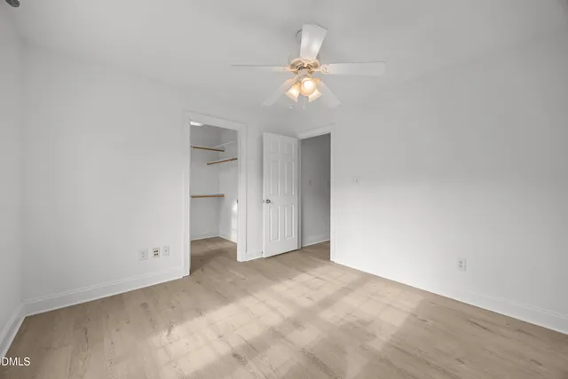 a bathroom with a granite countertop sink mirror and bathtub