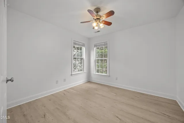 a view of a livingroom with a chandelier fan