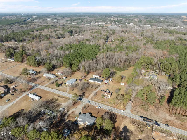 an aerial view of house with yard