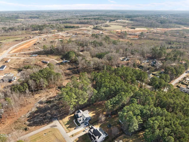 a view of entryway with wooden floor and stairs