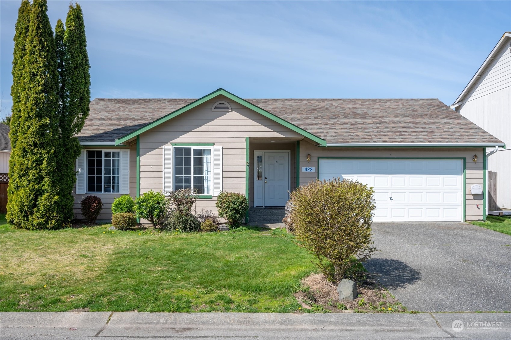 422 Spring Lane Sedro-Woolley, WA 98284 - Photo 1 of 25 a front view of a house with garden