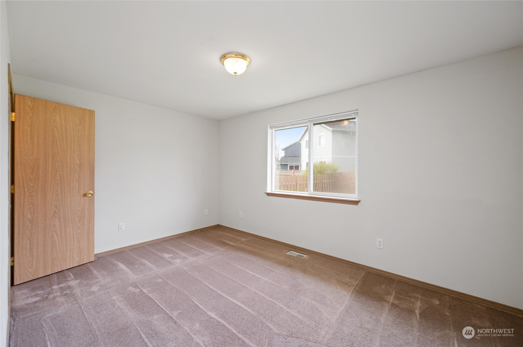 422 Spring Lane Sedro-Woolley, WA 98284 - Photo 11 of 25 an empty room with windows