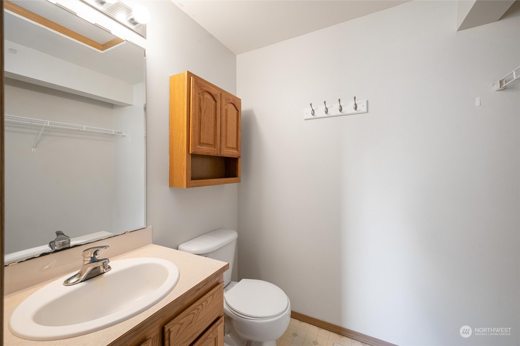 422 Spring Lane Sedro-Woolley, WA 98284 - Photo 13 of 25 a bathroom with a sink a toilet and mirror