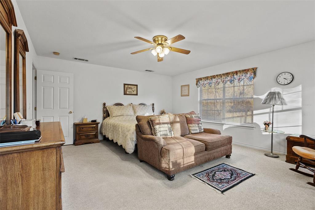 80 Campbell Road Sadler, TX 76264 - Photo 8 of 29 Primary bedroom with sitting area, carpet and ceiling fan