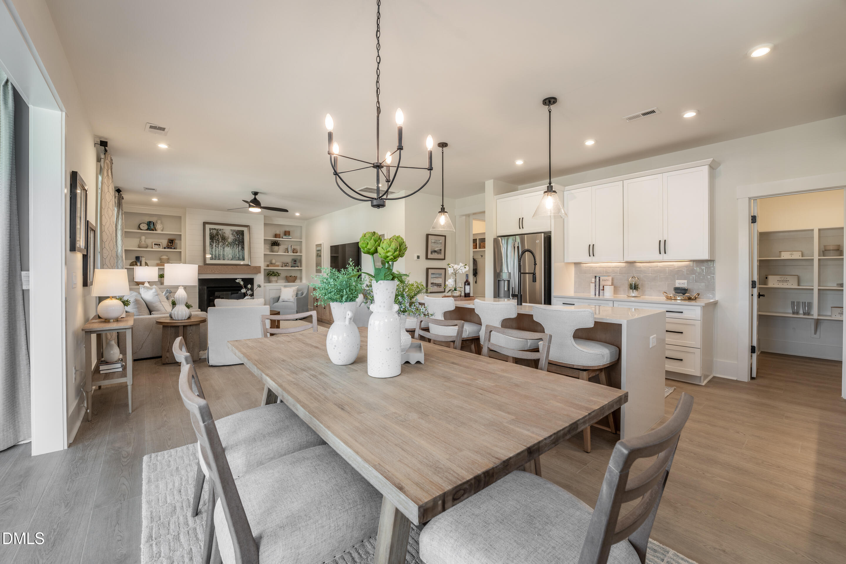415 Heidi May Way Carthage, NC 28327 - Photo 15 of 48 a view of a dining room and livingroom with furniture wooden floor kitchen chandelier