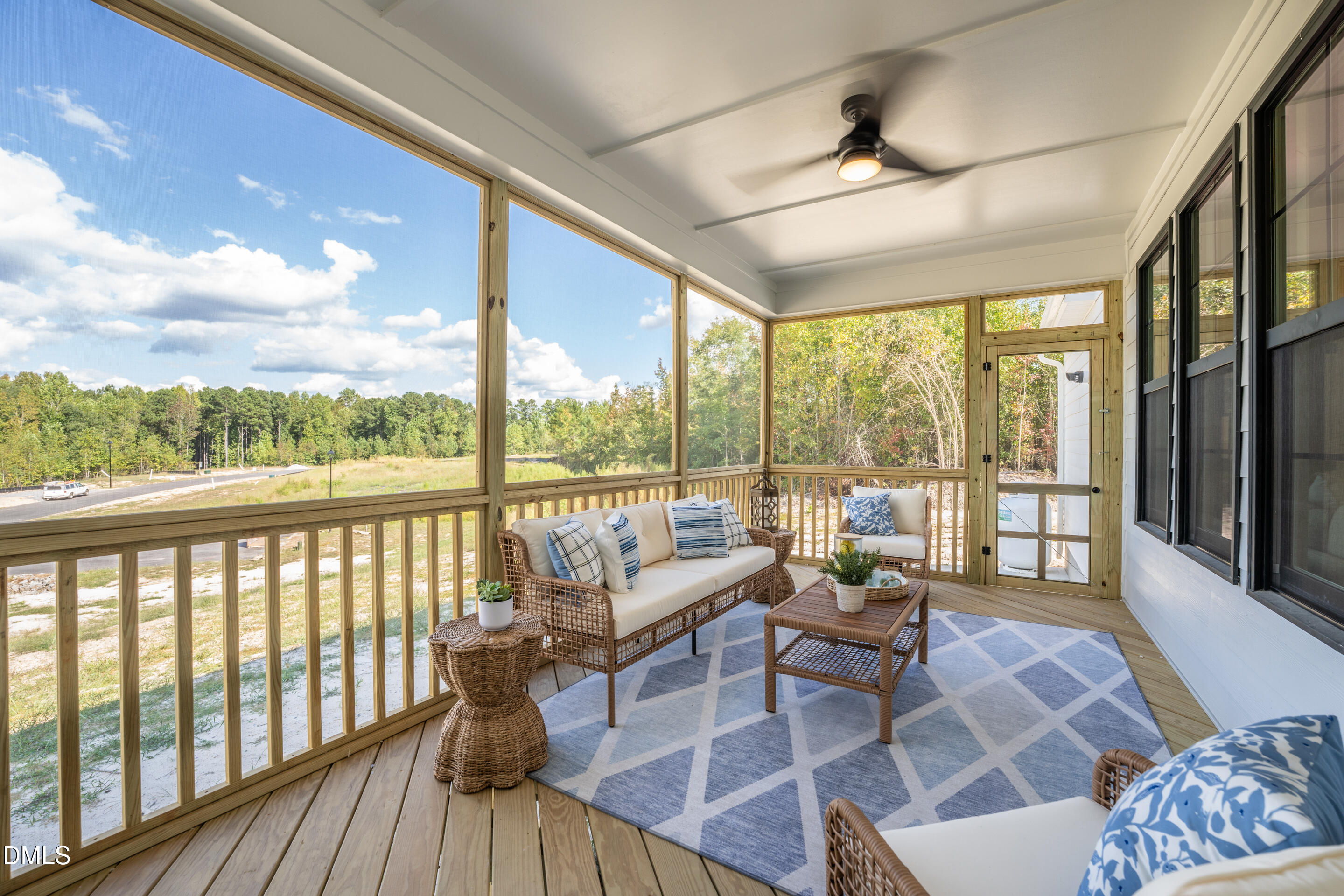 415 Heidi May Way Carthage, NC 28327 - Photo 17 of 48 a living room with furniture and floor to ceiling windows