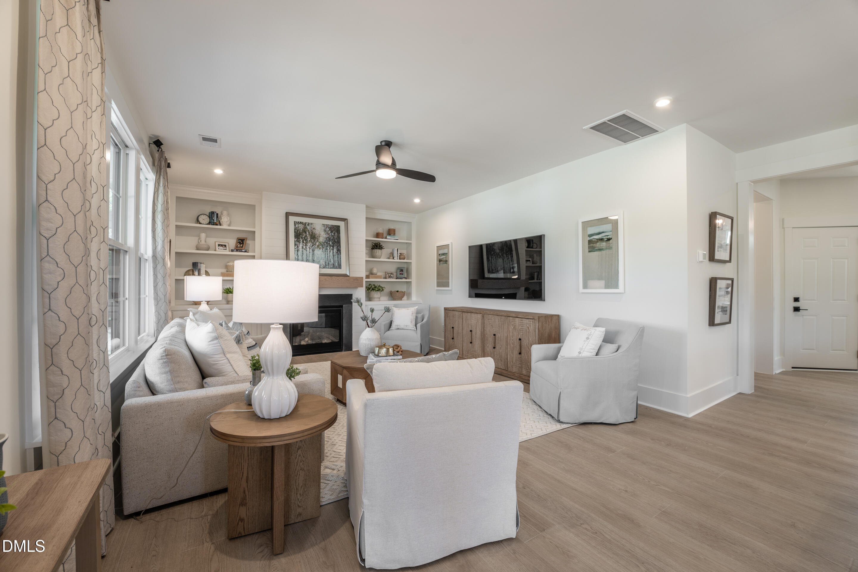 415 Heidi May Way Carthage, NC 28327 - Photo 21 of 48 a living room with furniture kitchen view and a flat screen tv