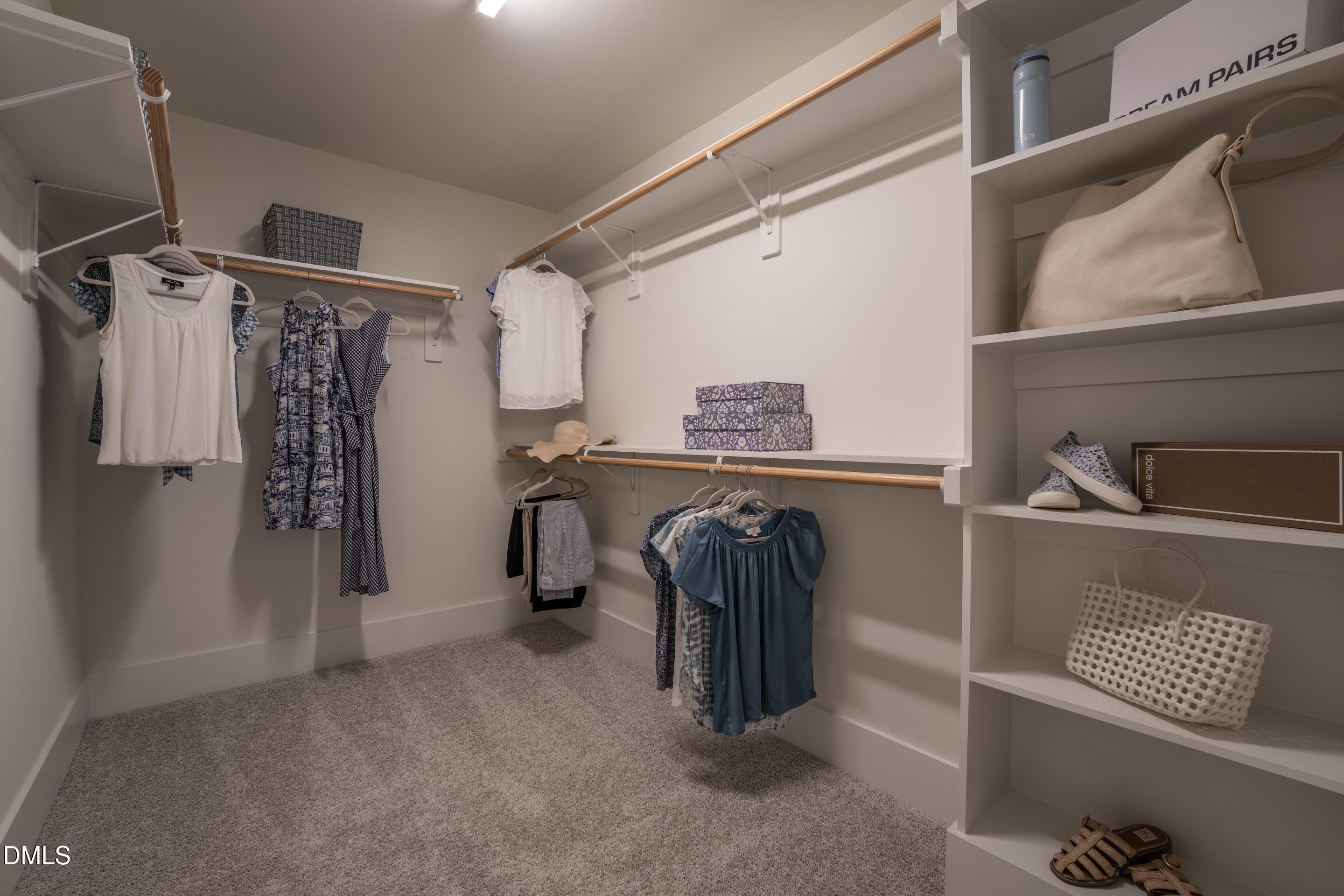 415 Heidi May Way Carthage, NC 28327 - Photo 33 of 48 a view of walk in closet with clothes and shoes