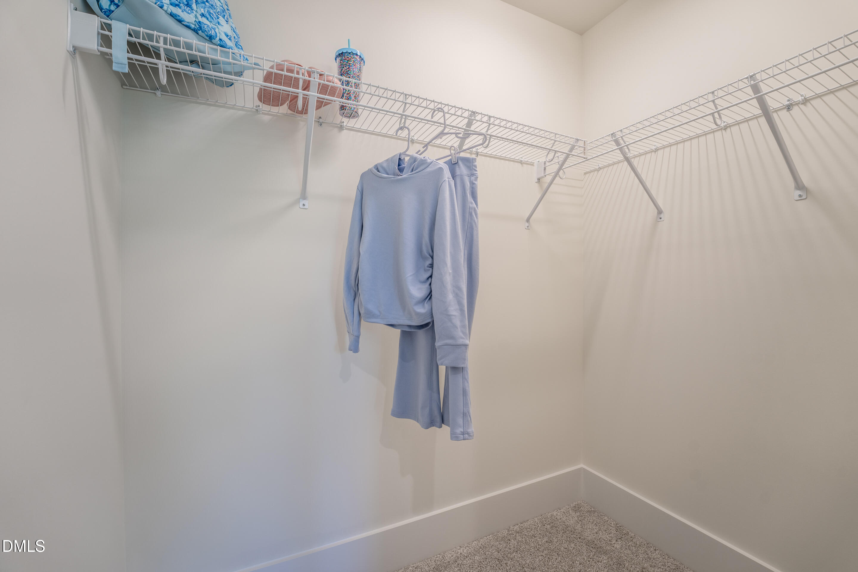 415 Heidi May Way Carthage, NC 28327 - Photo 36 of 48 a view of walk in closet with clothes and shoes