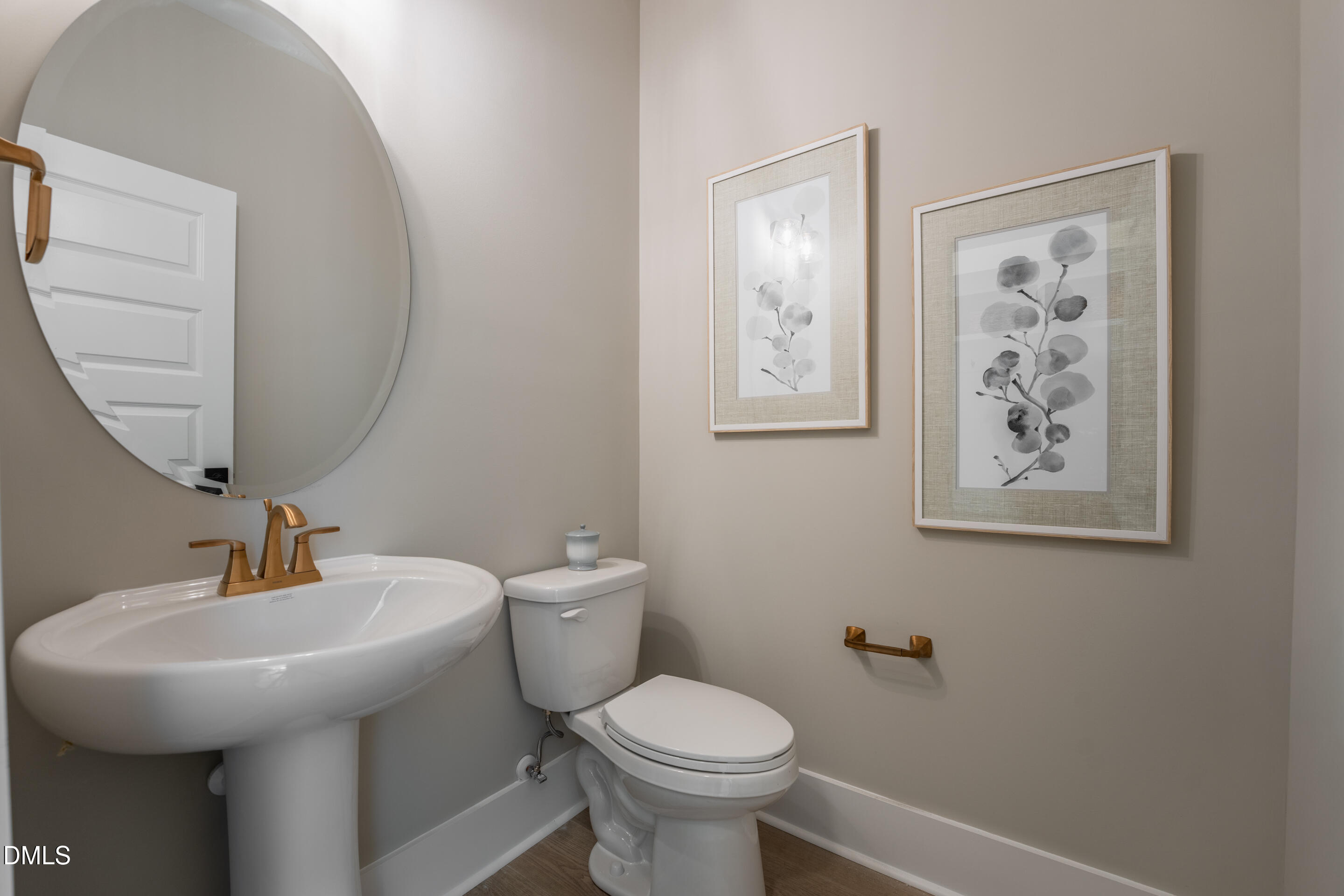 415 Heidi May Way Carthage, NC 28327 - Photo 6 of 48 a bathroom with a toilet sink and mirror