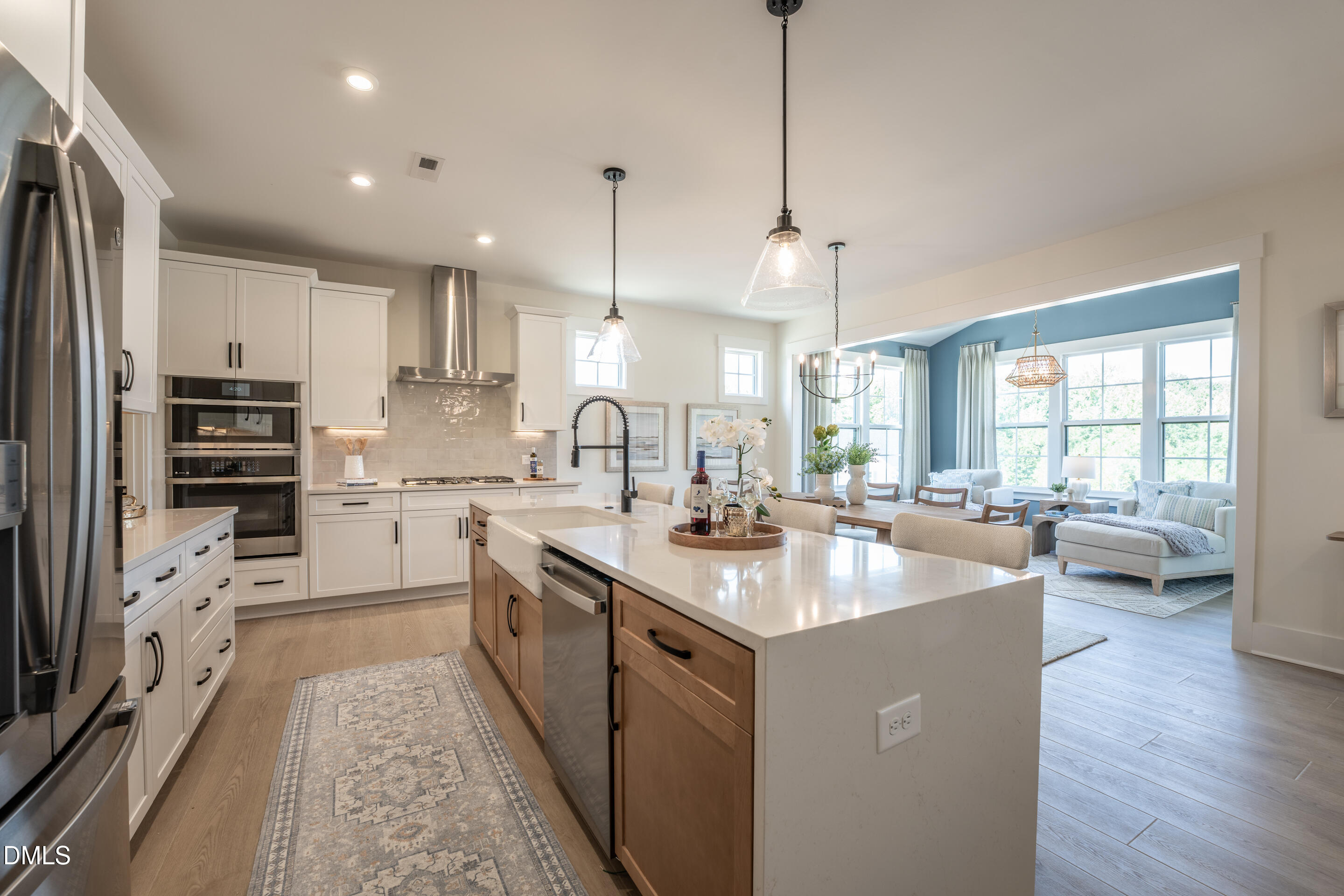 415 Heidi May Way Carthage, NC 28327 - Photo 9 of 48 a kitchen with white cabinets appliances a sink and a center island