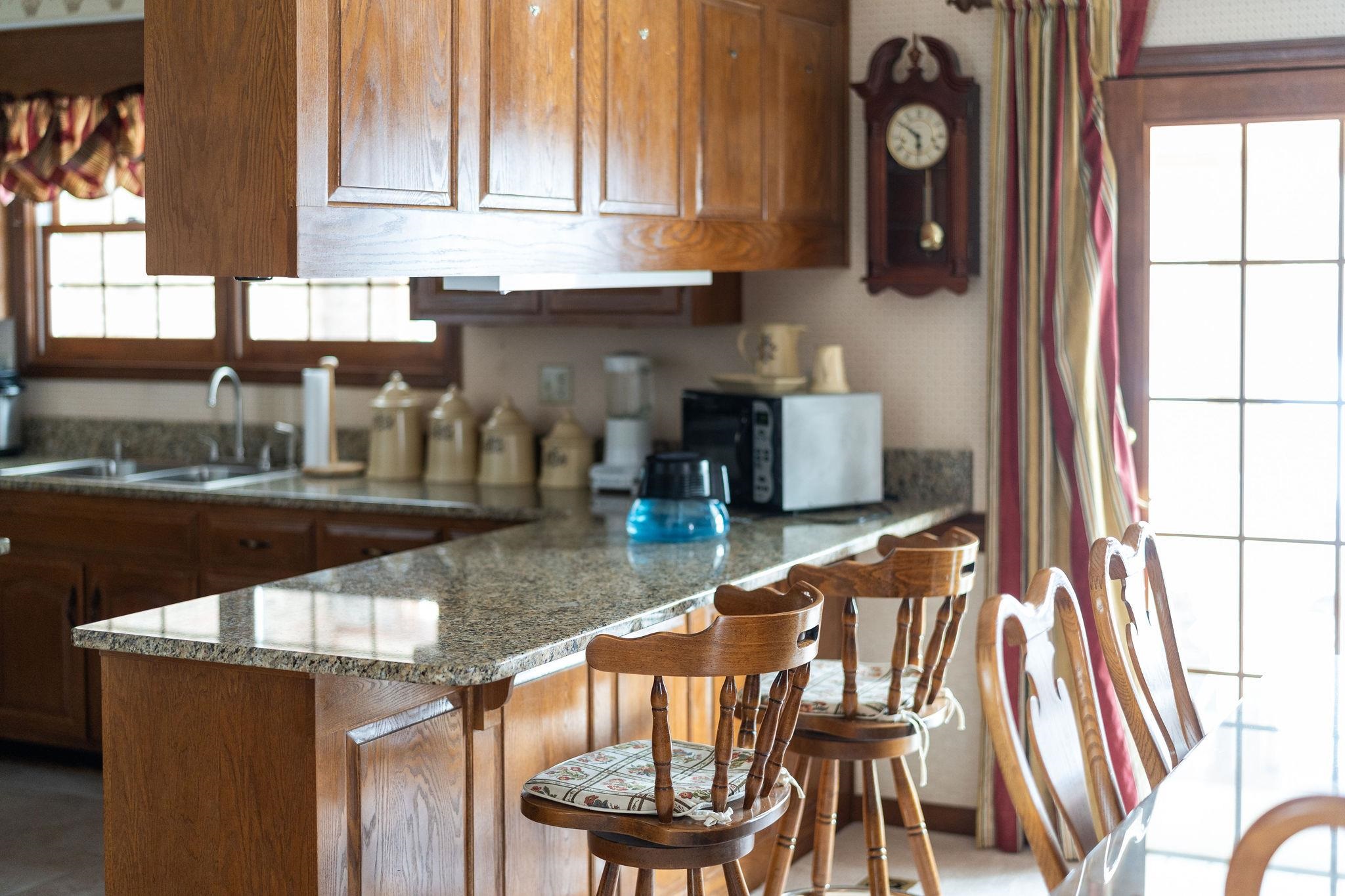 298 George Home Road Waynesboro, VA 22980 - Photo 17 of 59 a kitchen with a table chairs and a stove top oven