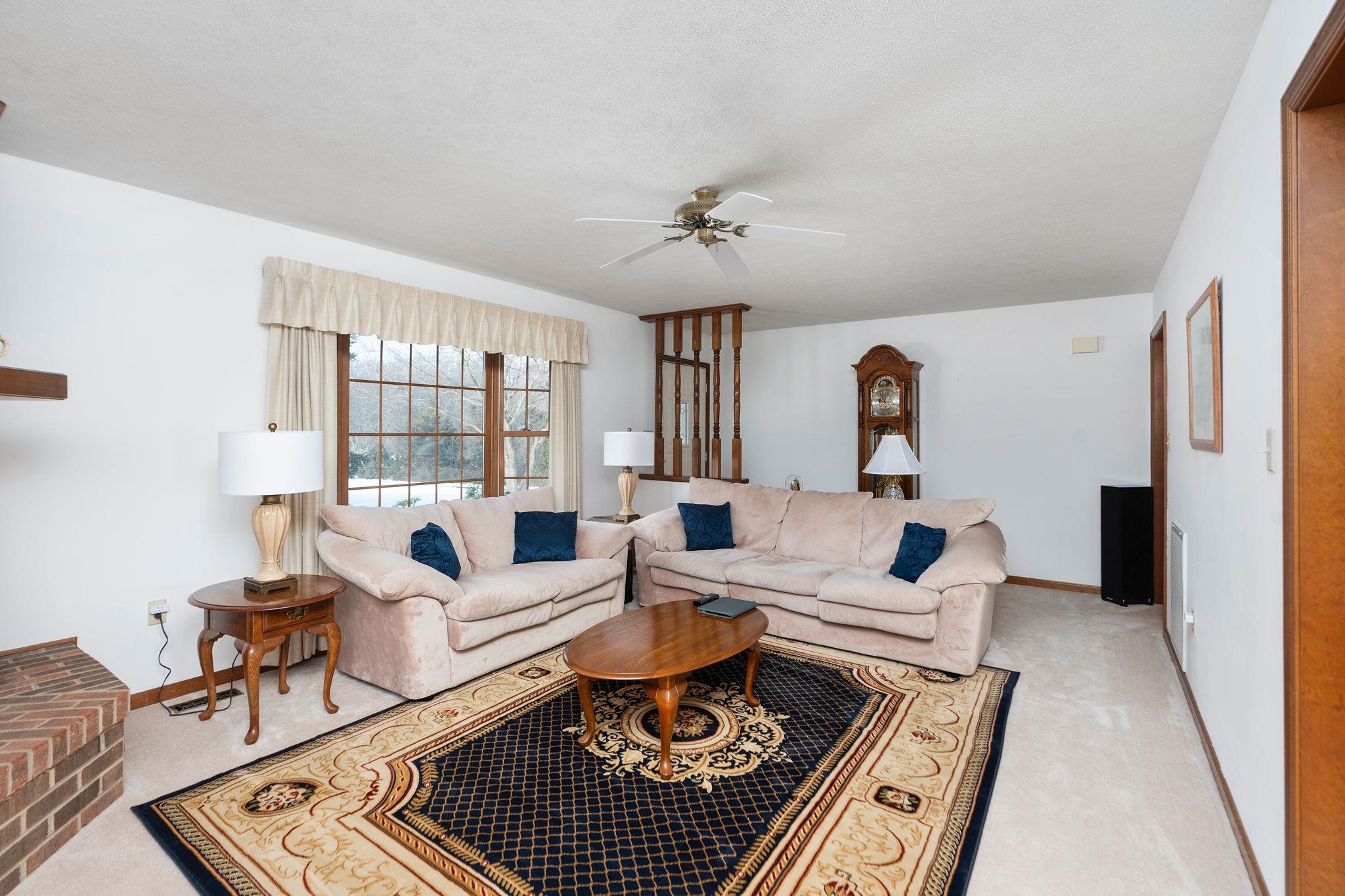 298 George Home Road Waynesboro, VA 22980 - Photo 3 of 59 a living room with furniture a rug and a chandelier