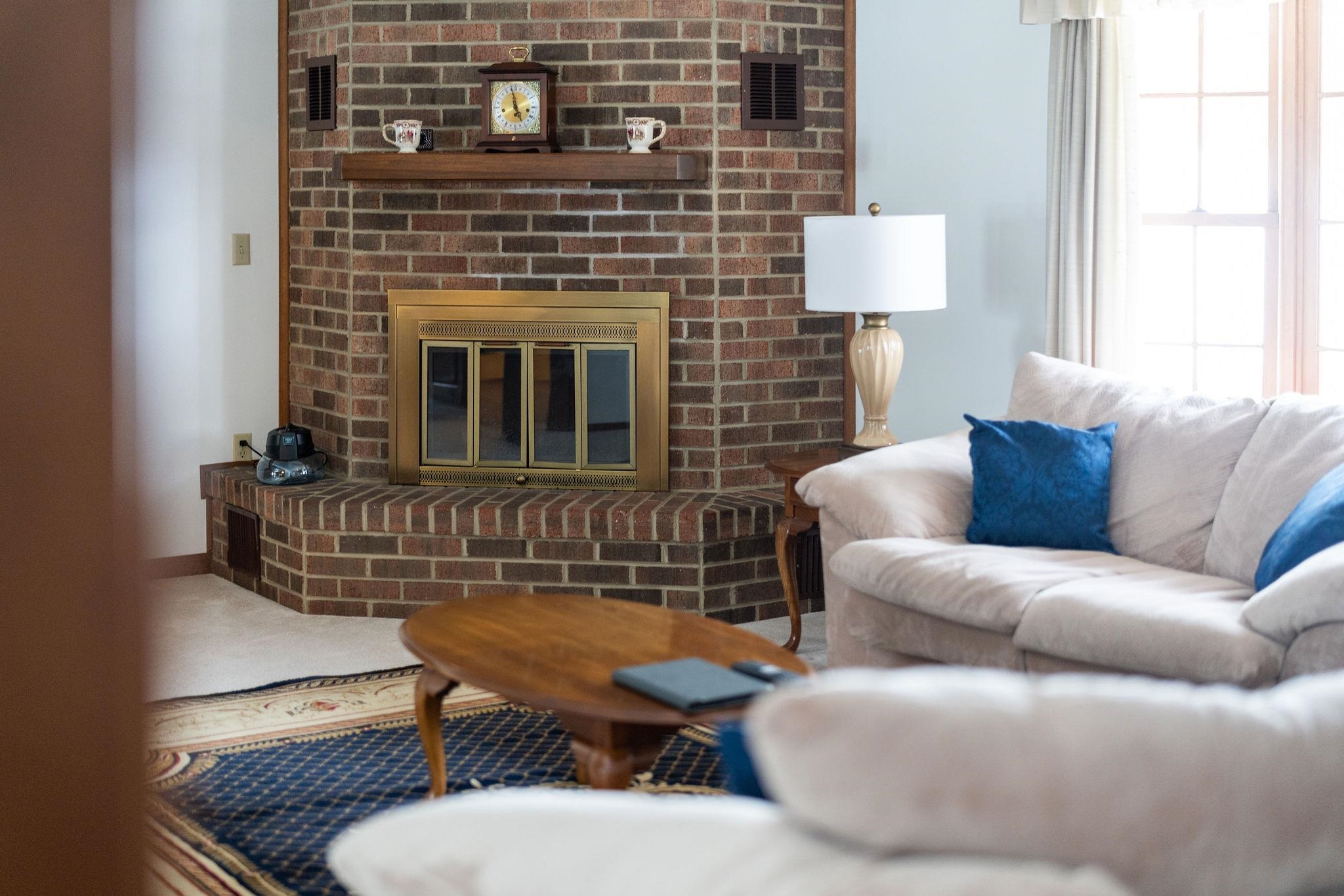 298 George Home Road Waynesboro, VA 22980 - Photo 5 of 59 a living room with furniture a table and a fireplace
