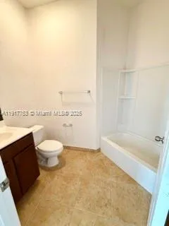 a bathroom with a toilet and a bathtub