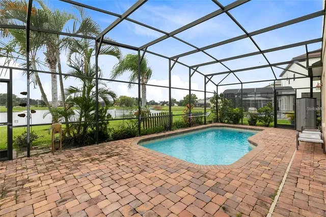 a view of a swimming pool with a patio