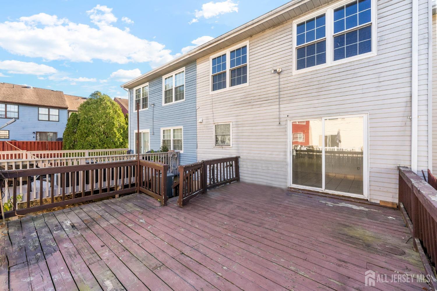 130 Pendleton Place Old Bridge, NJ 08857 - Photo 21 of 21 a view of a house with a wooden deck