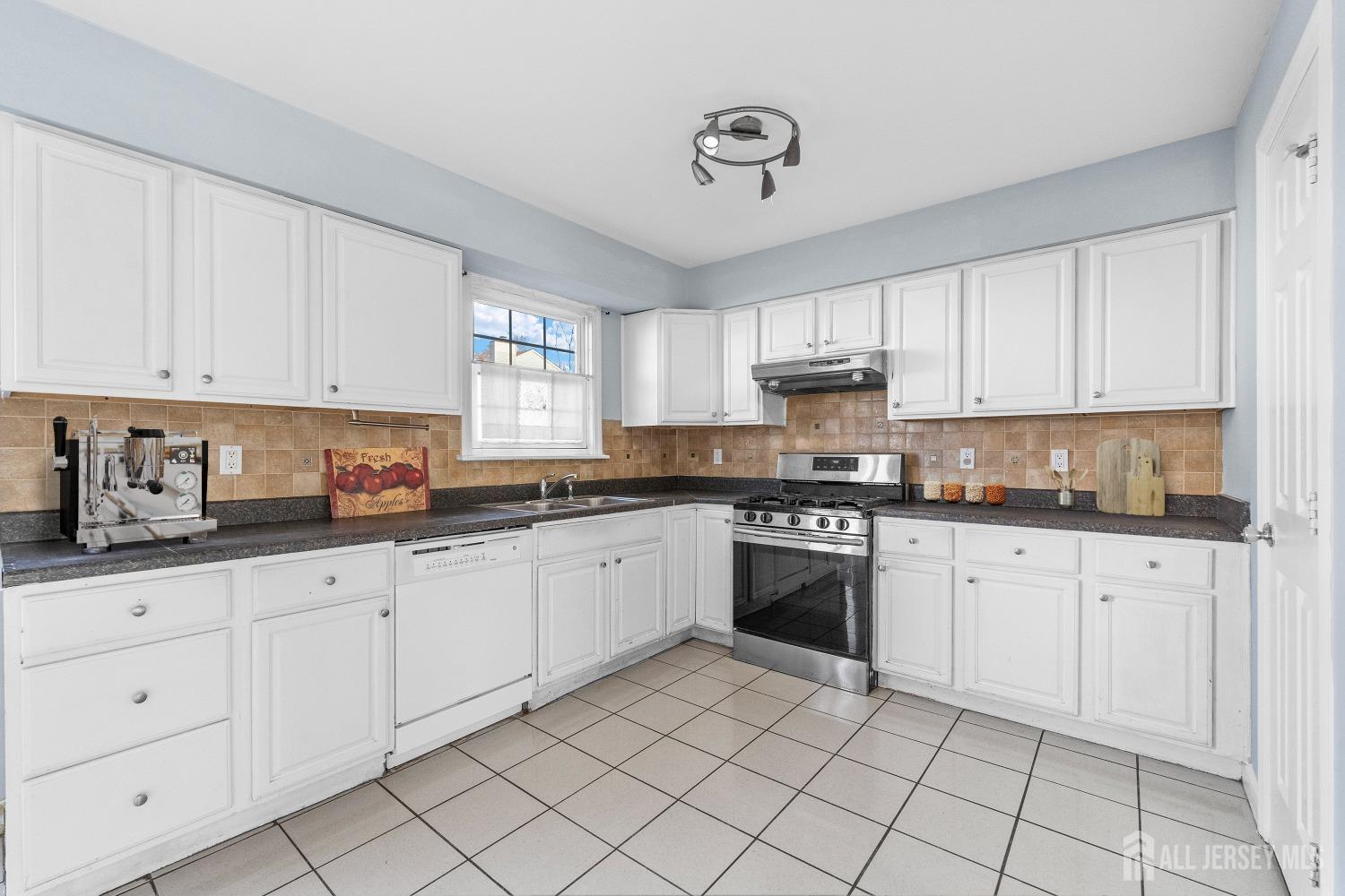 130 Pendleton Place Old Bridge, NJ 08857 - Photo 8 of 21 a kitchen with granite countertop white cabinets white stainless steel appliances with a sink and dishwasher