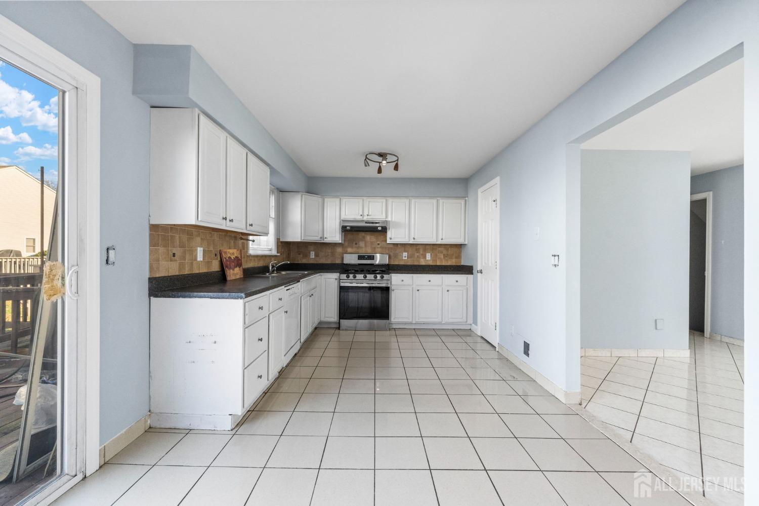 130 Pendleton Place Old Bridge, NJ 08857 - Photo 10 of 21 a kitchen with stainless steel appliances granite countertop a refrigerator and a stove top oven